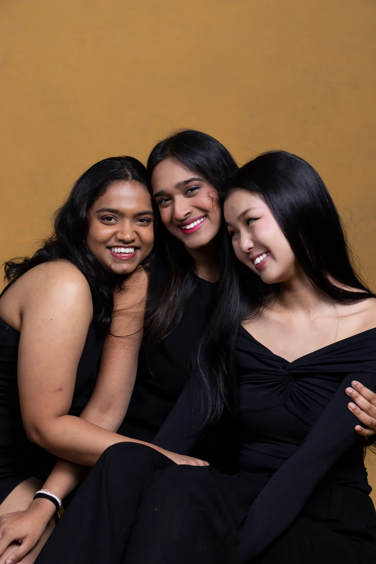 Three members of the Solace team smiling together